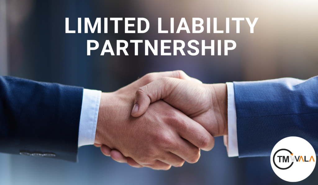 Two business professionals shaking hands, representing a Limited Liability Partnership (LLP).