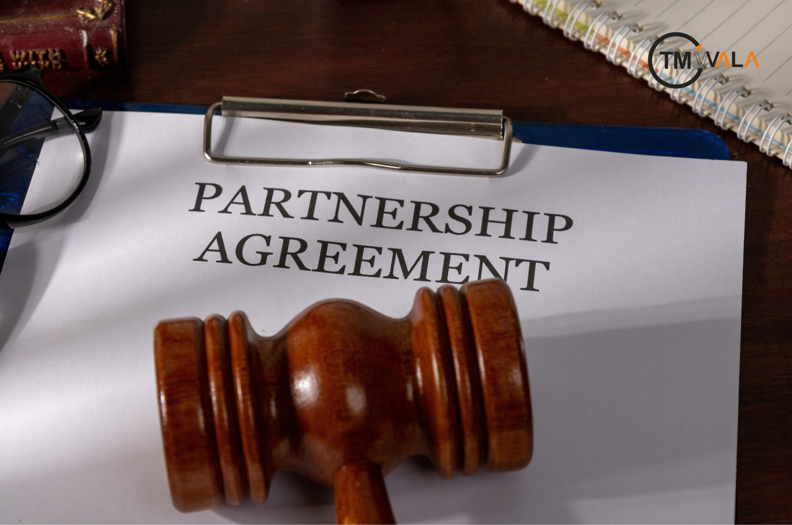 Partnership agreement document with gavel, legal contract concept.