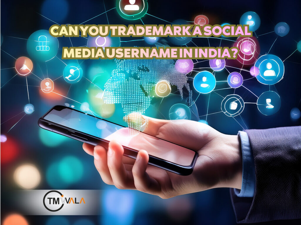 A person holding a smartphone with colorful digital social media icons floating around, with the text “Can You Trademark a Social Media Username in India?” displayed above.