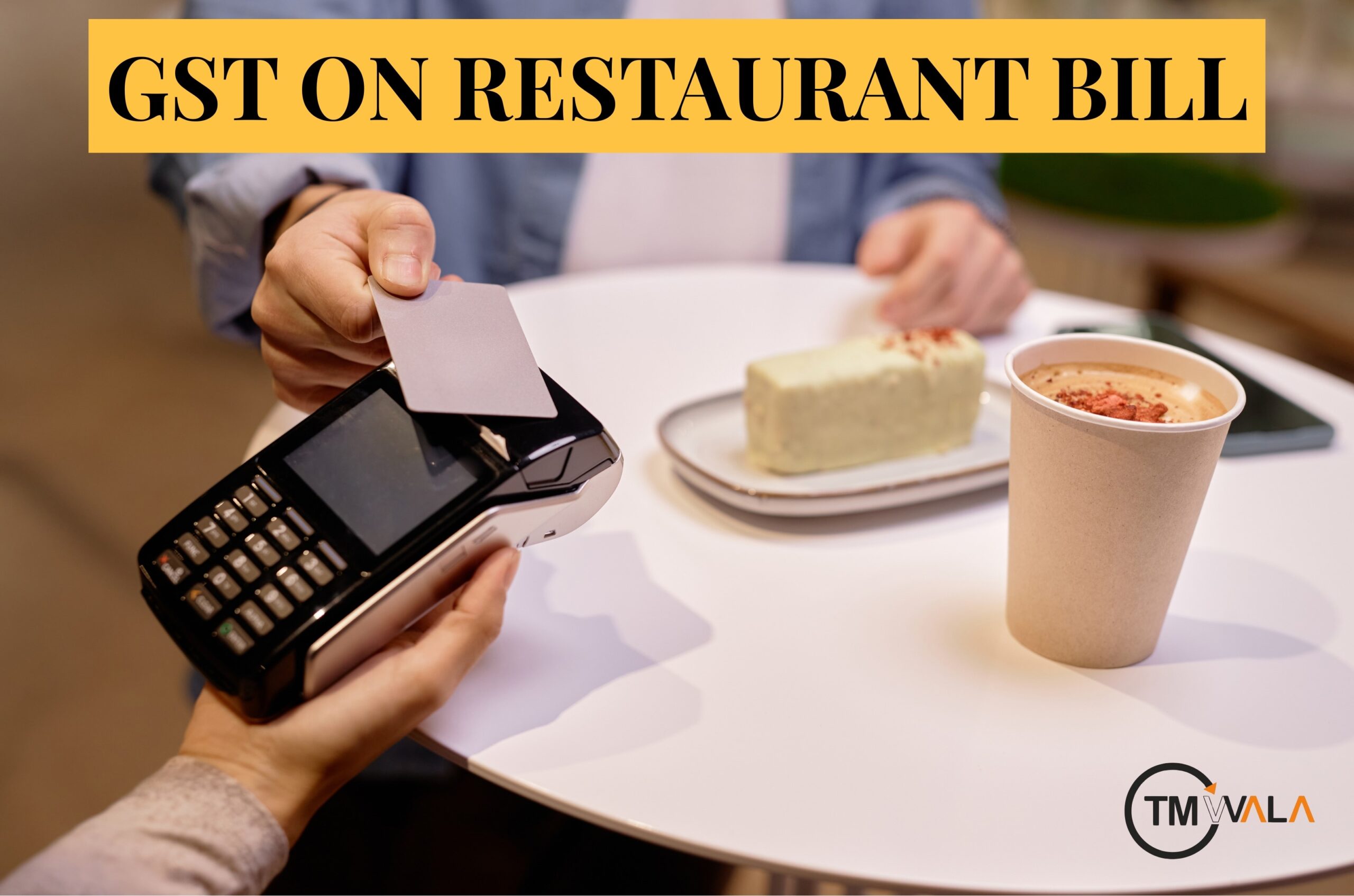 restaurant table with food and a beverage, with the text “GST on Restaurant Bill” displayed above.